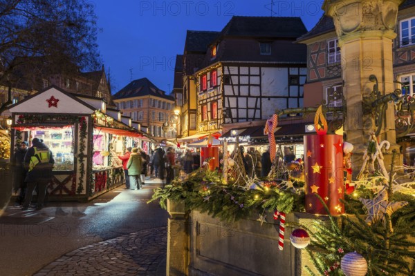 Colourfully illuminated and Christmassy decorated half-timbered houses, old town, blue hour, Colmar, Haut-Rhin department, Alsace, France