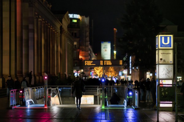 Night view, Königsstraße, Königsbau, entrance to the underpass to the subway station Schlossplatz station, escalators, passers-by, behind the main train station, Bonatzbau station tower, dark, Stuttgart, Baden-Württemberg, Germany