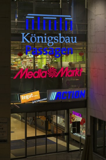 Night view, logo media market, Tegut, action, entrance Königsbau Passagen, shopping center, Stuttgart, Baden-Württemberg, Germany
