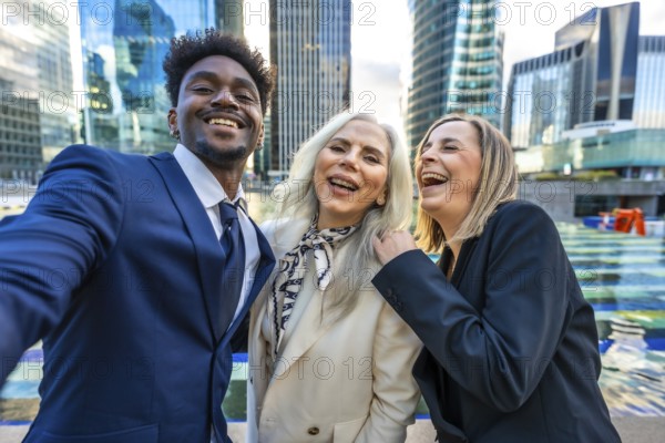 Diverse business professionals feeling happy and celebrating success while taking a selfie together, showcasing teamwork, collaboration, and a positive work environment in a modern city setting
