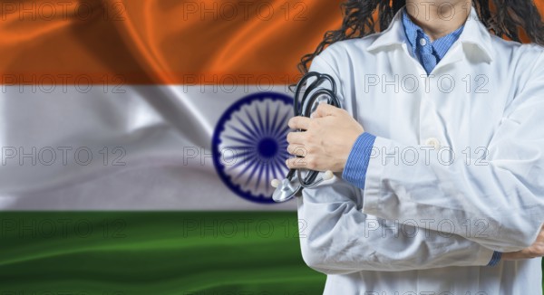 Healthcare professional with India flag background. Professional doctor holding stethoscope on India flag background