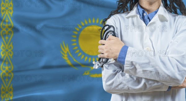 Healthcare professional with Kazakhstan flag background. Professional doctor holding stethoscope on Kazakhstan flag background