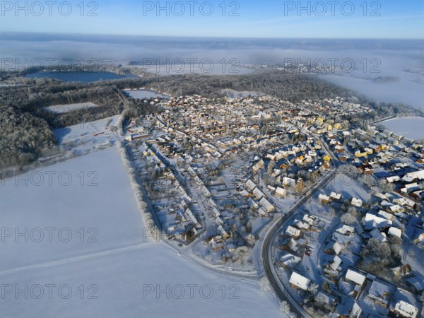 Wintery village landscape in foggy surroundings with snowy forests and fields, aerial view, partly fog, Bülten, Ilsede, Lower Saxony, Germany