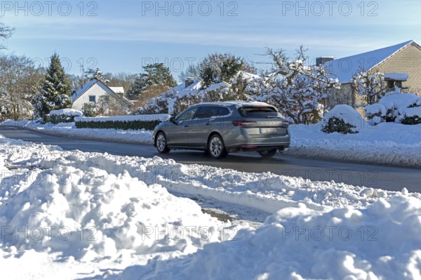 Snowy road, car, houses, winter, snow, Sieversen, Samtgemeinde Rosengarten, Lower Saxony, Germany