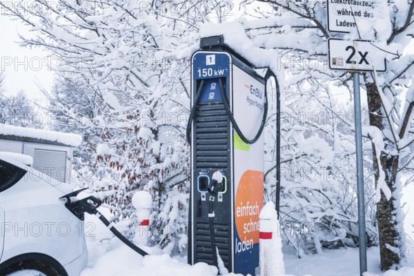 Close-up of a snowy charging station for electric cars with colorful details, Tesla Model Y electric car, ENBW charging station, Waldachtal, Freudenstadt district, Germany