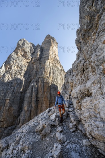 Climbers on the Via Ferrata Bocciere Centrale via ferrata, spectacular mountain landscape with steep rock faces, Brenta Mountains, Parco Naturale Brenta-Adamello, Trentino, Italy