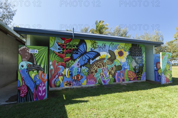 August 19, 2020. Artistically painted public toilet block featuring nature murals in a tropical park. South Mission Beach, Queensland, Australia