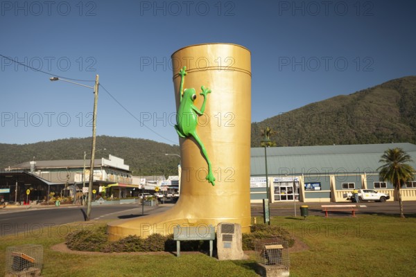 Famous giant boot monument and tourist landmark on a bright sunny day. Golden Gumboot, Tully, Queensland, Australia