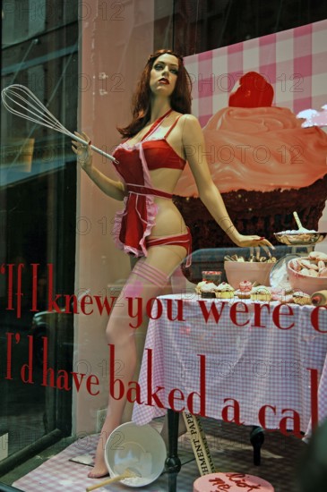 Lightly dressed mannequin of a pastry shop, New York City, USA