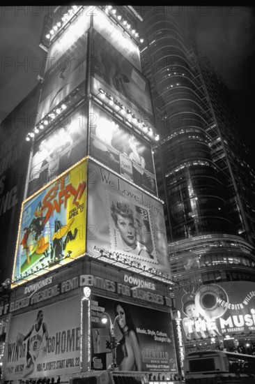 Illuminated advertising on Time Square at night, black and white, New York City, USA