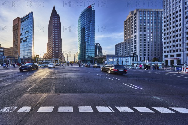 Potsdamer Platz, Forum Tower, Kollhoff Tower and Railway Tower skyscrapers, commercial buildings, modern architecture, road markings lanes, cars, pedestrians as accessories, back light, blue sky, cumulus clouds, cirrus clouds, dramatic image processing, intersection between Potsdamer Platz, Ebertstraße, Potsdamer Straße and Leipziger Platz, Berlin, capital, district-free city, federal state of Berlin, Germany
