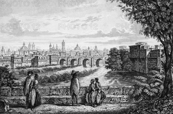 City view of Lima on Rio Rimac, state capital, view from stone bridge, city center, numerous churches, domed building, buildings on the shore, in front of local men and woman, Peru, historical illustration 1888