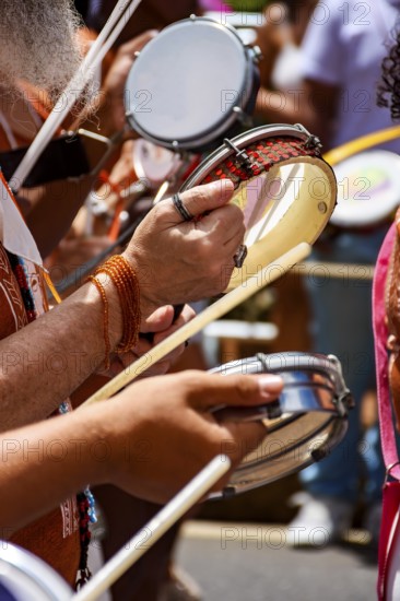 Tambourines and musicians during a carnival celebration in the streets of Brazil, Belo Horizonte, Minas Gerais, Brazil