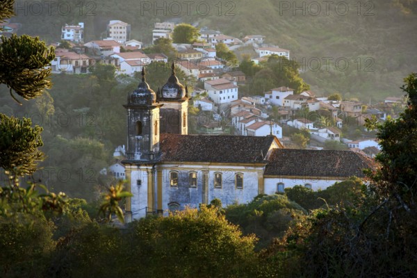 Church and historic city of Ouro Preto seen through the vegetation, Ouro Preto, Minas Gerais, Brazil