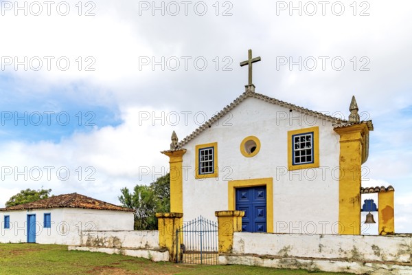 Old colonial-style house and church in a small village in the state of Minas Gerais, Minas Gerais, Brazil