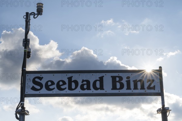 Sign Seebad Binz on the pier, back light with sun star, Binz, seaside resort, Rügen island, Mecklenburg-Western Pomerania, Germany