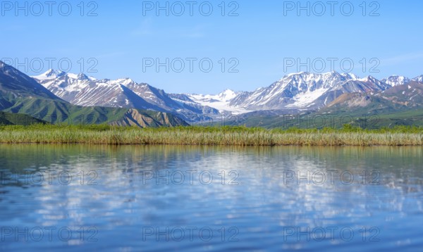 Lake and picturesque mountain landscape with Gulkana glacier and summit Icefall Peak, Richardson Highway, Alaska Range, Alaska, USA
