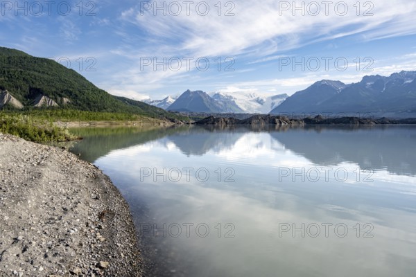 Mountain landscape reflected in glacial lake, Mount Blackburn and Kennicott Glacier, McCarthy Road, Wrangell St. Elias National Park, Alaska, USA
