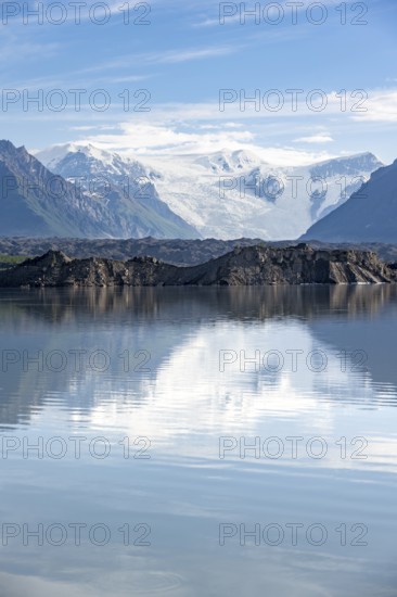 Mountain landscape reflected in glacial lake, Mount Blackburn and Kennicott Glacier, McCarthy Road, Wrangell St. Elias National Park, Alaska, USA