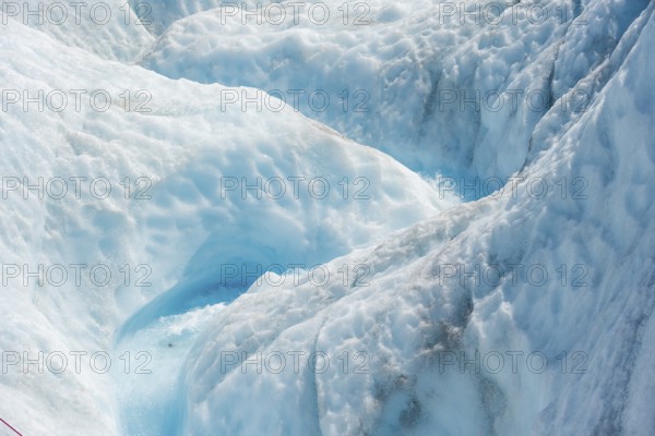 Waterfall in a crevasse on the ice of Root Glacier, Wrangell St. Elias National Park, Alaska, USA