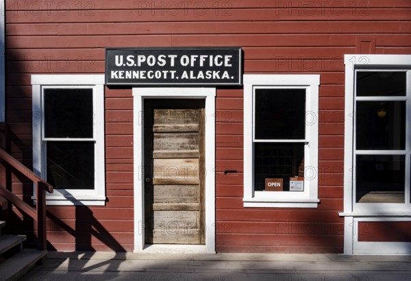 Red Kennicott buildings against mountainous landscape, Kennecott Post Office, Historic Kennecott Copper Mine, National Historic Landmark, Wrangell St. Elias National Park, Alaska, USA