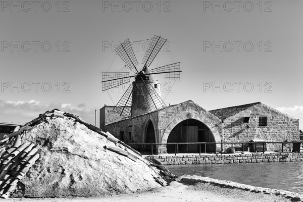 Salt museum, traditional windmill, nature reserve of saltworks di Trapani and Paceco, traditional salt production, monochrome, Nubia, Trapani, salt route, Sicily, southern Italy, Italy
