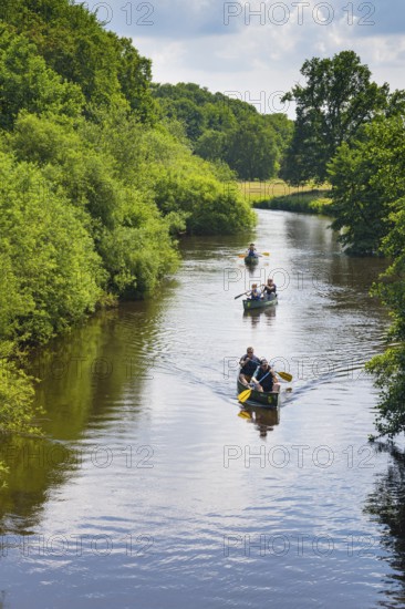 Canoeists do water sports on the Hunte near Astrup, Barneführer Holz, Wardenburg, Lower Saxony, Germany