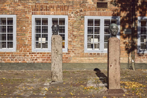 Bust of Lorenz von Stein and Wilhelm Lehmann, sculptor Manfred Sihle-Wissel, historic town hall, brick building, façade with windows, paving stone square, town hall market, Eckernförde, Rendsburg-Eckernförde district, Schleswig-Holstein, Germany