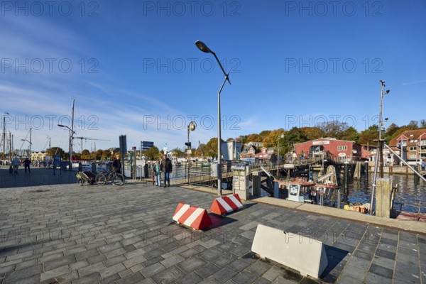 Wooden bridge, pedestrian bridge, harbor, harbor basin, general architecture, boats, trees, road made of concrete paving stones, pedestrians as accessories, blue sky, cirrus clouds, harbour road, Eckernförde, Rendsburg-Eckernförde district, Schleswig-Holstein, Germany