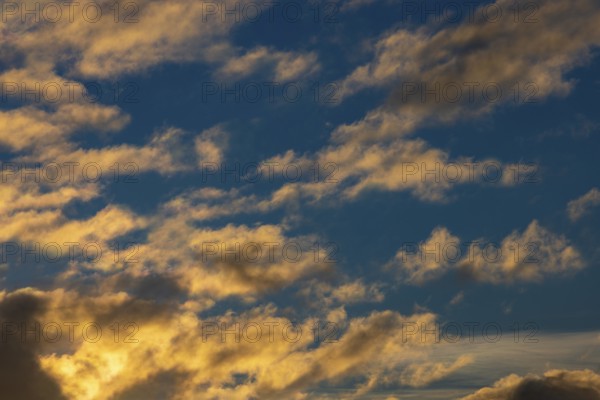 Small clouds in sunset on blue sky, Austria