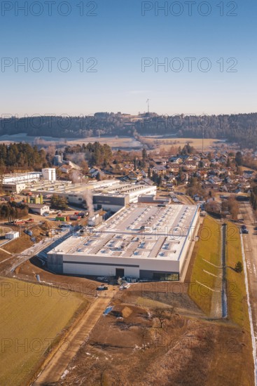 Industrial complex and village surrounded by forests and hills, Glatten, Freudenstadt district, Germany