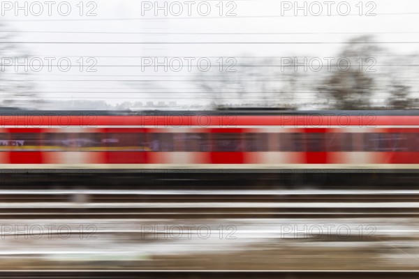 S-Bahn on the open route. motion blur. Esslingen, Baden-Württemberg, Germany