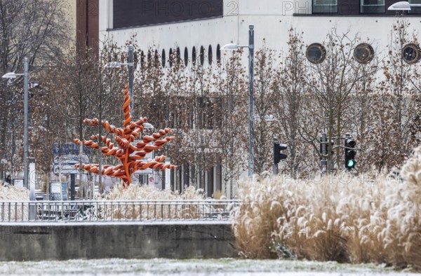 Winter in Stuttgart. There is a closed blanket of snow in the city center. Württembergische Landesbibliothek. 'Red Tree' artwork by Mariella Mosler. Stuttgart, Baden-Württemberg, Germany