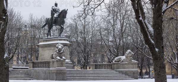 Winter in Stuttgart. There is a closed blanket of snow in the city center. Karlsplatz with equestrian monument to Emperor Wilhelm I. Stuttgart, Baden-Württemberg, Germany
