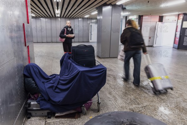 Winter in Stuttgart. A homeless person has made a home for himself in the Velcro Passage. Stuttgart, Baden-Württemberg, Germany