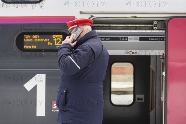 Winter in Stuttgart. There is also a closed layer of snow in the main train station. TGV on the platform. Stuttgart, Baden-Württemberg, Germany