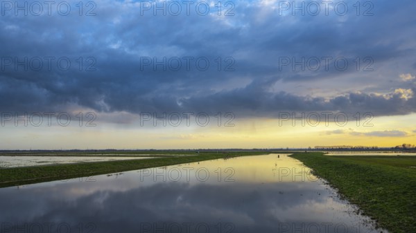 Sunset is reflected in the Hunte in Ochsenmoor at Dümmer See, Hüde, Lower Saxony, Germany
