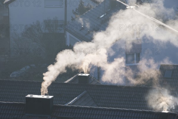 Close-up of a chimney from which smoke rises in a quiet morning mood, symbolic picture, fireplaces, gas heating, oil heating, fossil fuels, climate change, global warming, chimneys, Baden-Württemberg, Germany
