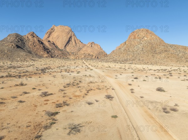 Aerial view, road and mountains in the desert, Spitzkoppe summit, Namib desert, Namibia