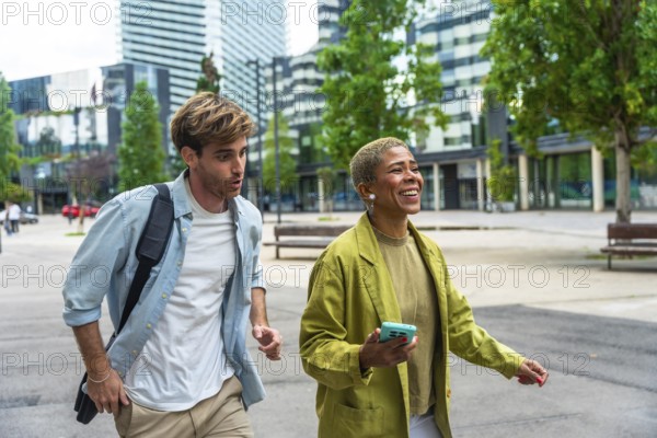 Diverse business colleagues walking actively outdoors in a modern urban environment, sharing a dynamic conversation while moving between buildings in the city