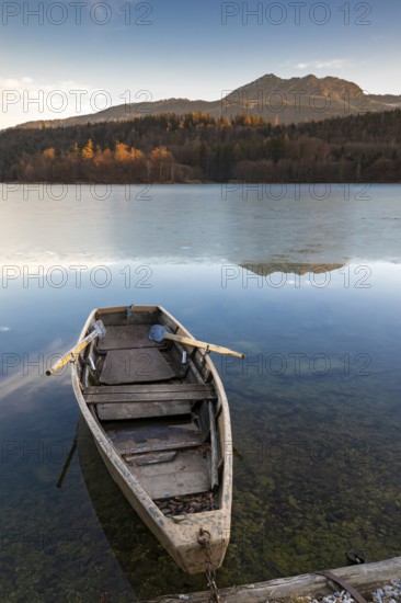 Wooden rowing boat on wintry Reintaler See, Reintaler See, Tyrol, Austria