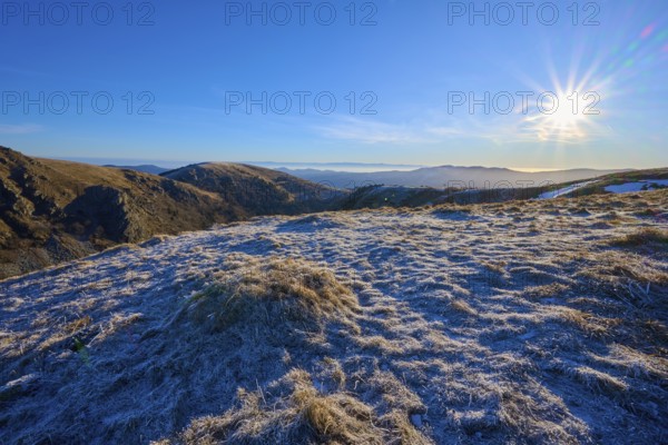 A frosty landscape under bright sunlight and a clear blue sky, winter, Route de Cretes, Hohneck, La Bresse, Vosges, France