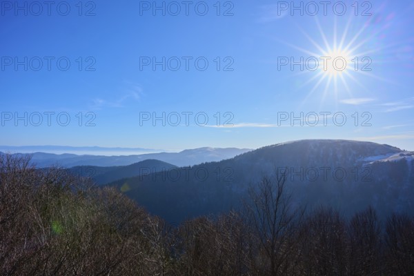 Bright sun over mountains with clear blue sky, winter view, morning, view, Rhine Valley, Martinswand, Frankental, Vosges, France