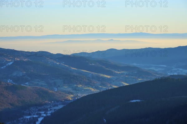Morning view of hills and valleys with light fog and peaceful ambiance, looking towards the Rhine Valley, viewpoint, La gorge de Pierrel, Frankental, Vosges, France