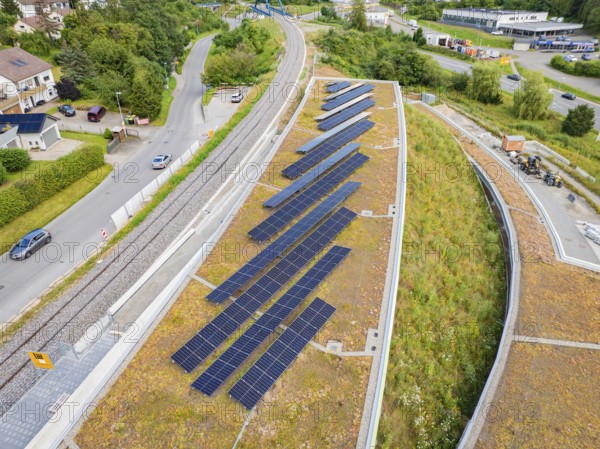 Green roof area with solar panels and surrounding infrastructure, new park and ride car park Calw Heumaden on the new Hermann Hessebahn, Calw, Germany