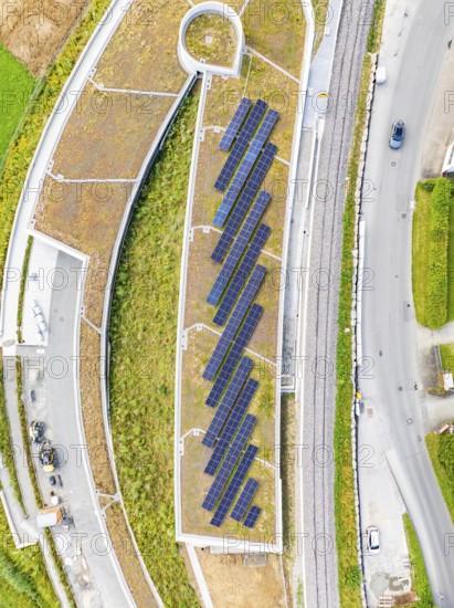 Flat roof with solar panels and surrounding infrastructure from a bird's eye view, new Park and Ride Calw Heumaden car park on the new Hermann Hessebahn, Calw, Germany