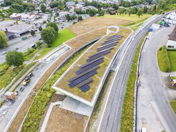 Modern solar roof construction in an urban environment, surrounded by infrastructure, new Park and Ride Calw Heumaden car park on the new Hermann Hessebahn, Calw, Germany