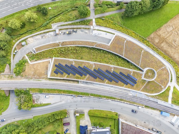 Large solar systems on a covered parking lot surrounded by roads and greenery, new Park and Ride Calw Heumaden car park on the new Hermann Hessebahn, Calw, Germany