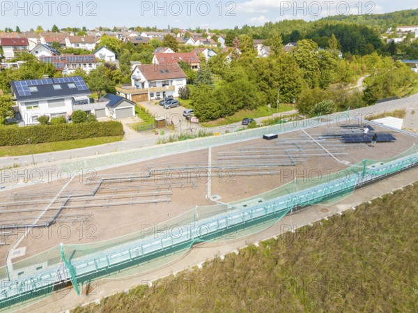 Construction site for solar systems in a quiet residential area with green areas and sun, new park and ride parking garage Calw Heumaden on the new Hermann Hessebahn, Calw, Germany