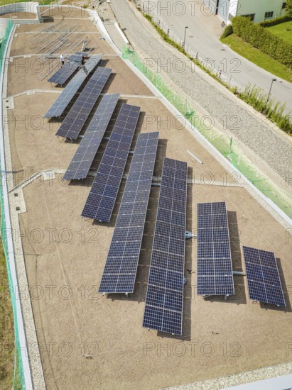 Aerial view of structured solar modules on a gravel roof, new Park and Ride Calw Heumaden car park on the new Hermann Hessebahn, Calw, Germany